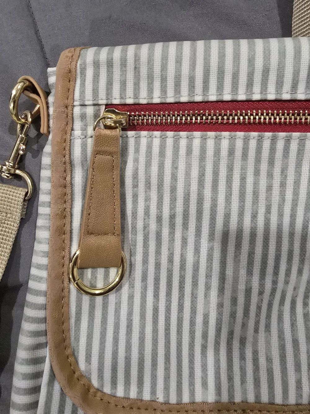 Skip Hop Gray and White Striped Messenger Bag with Tan Trim and Red Accent
